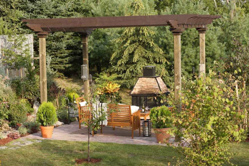 A nice, party-ready backyard with shaded patio and picnic table