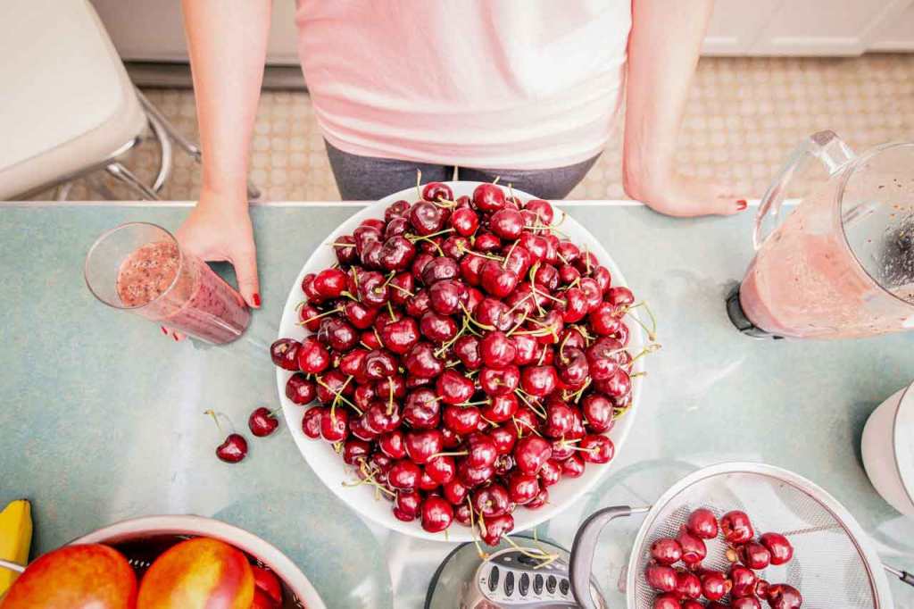 Bowl of fresh cherries on a kitchen countertop