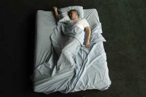 Older woman trying to sleep in bed