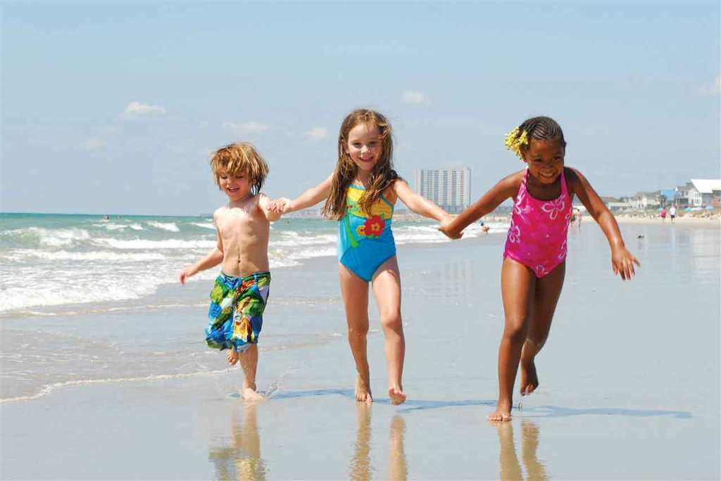 Grandchildren playing on the beach