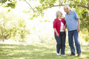 Elderly couple going for a walk outside.